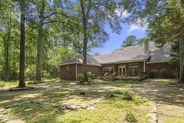 52 Eastgate Dr, Brandon, MS 39042 - rear view of property featuring a wooden deck, brick siding, and a chimney