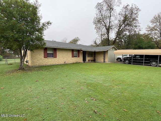 view of front of property featuring a carport and a front lawn