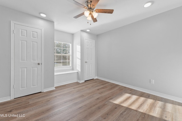 unfurnished bedroom featuring light hardwood / wood-style floors and ceiling fan