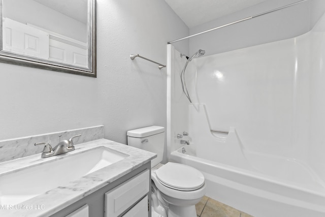 full bathroom featuring a textured ceiling, toilet, vanity, bathing tub / shower combination, and tile patterned flooring