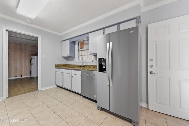 kitchen with water heater, crown molding, a textured ceiling, and stainless steel appliances