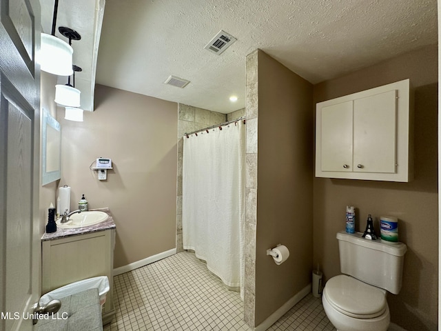 bathroom with toilet, tile patterned floors, walk in shower, and a textured ceiling