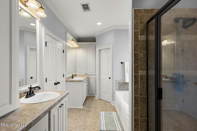 full bath featuring visible vents, a shower stall, two vanities, and a sink