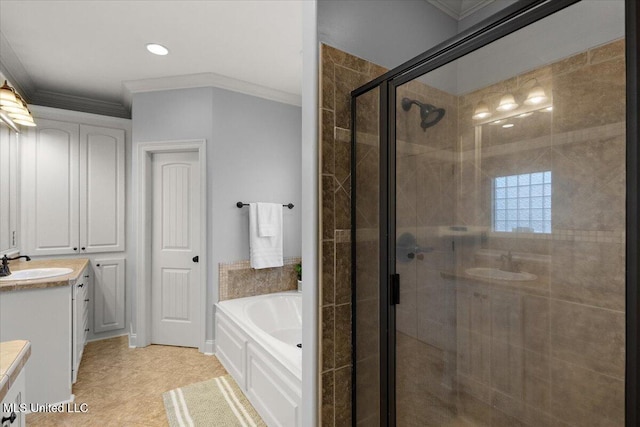 bathroom featuring a garden tub, a stall shower, ornamental molding, recessed lighting, and vanity