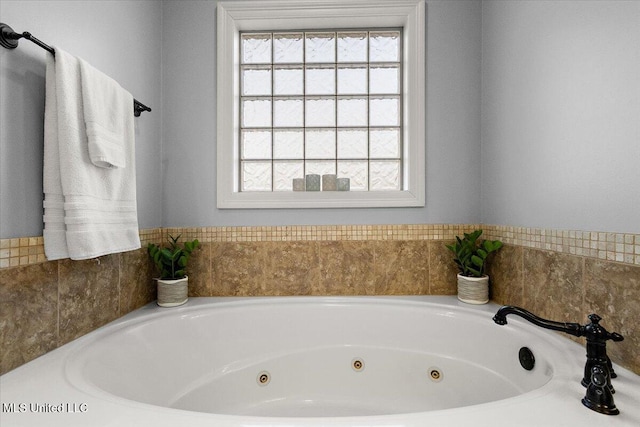 full bathroom featuring a whirlpool tub