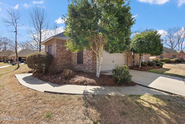 view of home's exterior featuring a garage, brick siding, driveway, and a lawn