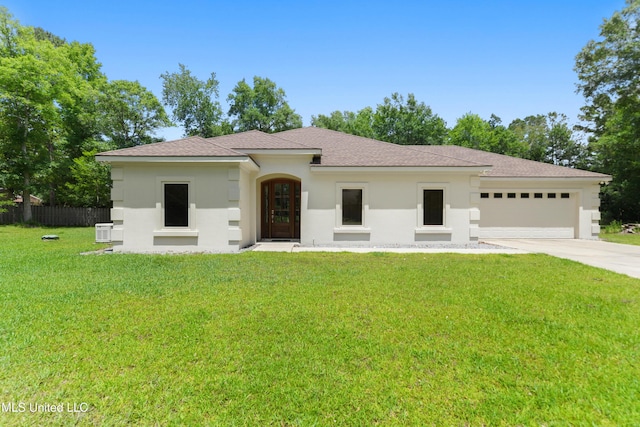 view of front of house with an attached garage, driveway, stucco siding, and a shingled roof