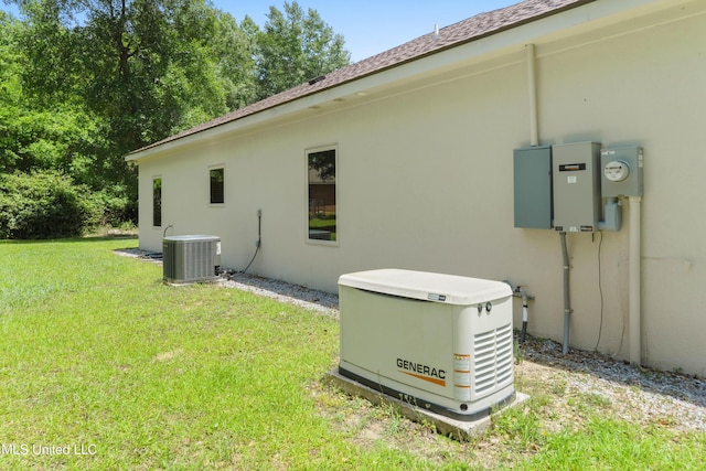 view of side of property with central AC unit, a yard, roof with shingles, and stucco siding