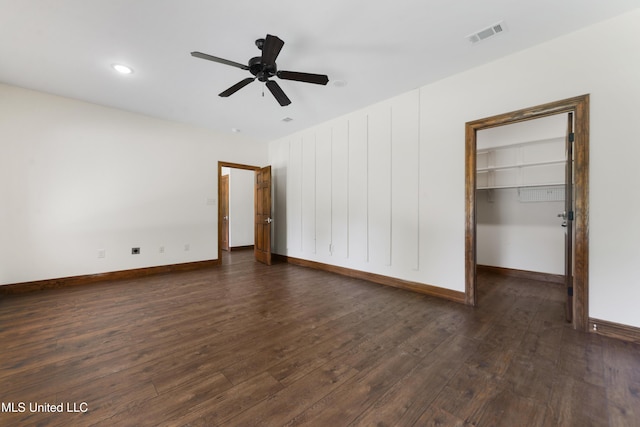 unfurnished room featuring dark wood-style floors, baseboards, a ceiling fan, and recessed lighting