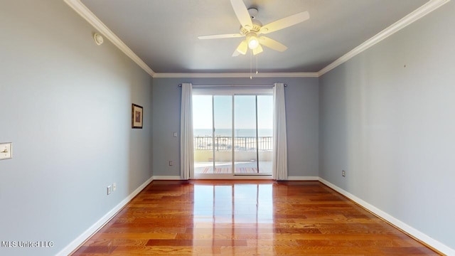 unfurnished room with ceiling fan, hardwood / wood-style flooring, and ornamental molding