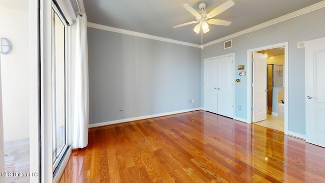 unfurnished bedroom with hardwood / wood-style flooring, ceiling fan, and ornamental molding