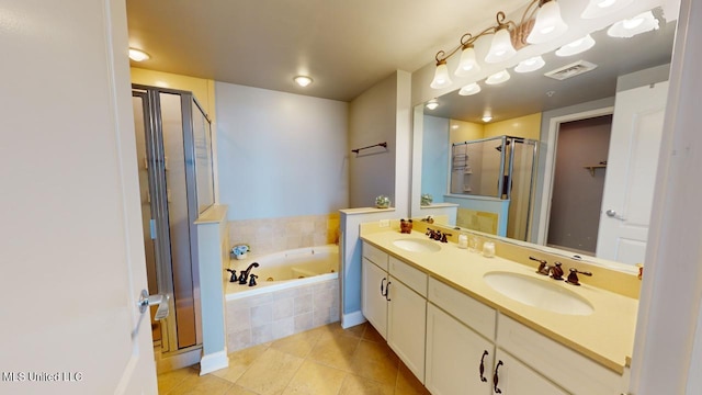 bathroom with tile patterned flooring, vanity, and independent shower and bath