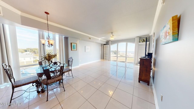 dining space featuring ceiling fan with notable chandelier, light tile patterned flooring, and ornamental molding