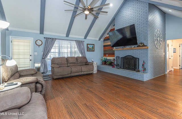 living room featuring a brick fireplace, ceiling fan, beamed ceiling, wood finished floors, and high vaulted ceiling