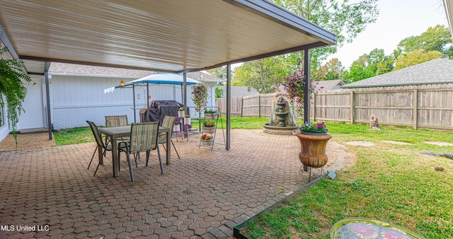 view of patio featuring outdoor dining space and a fenced backyard