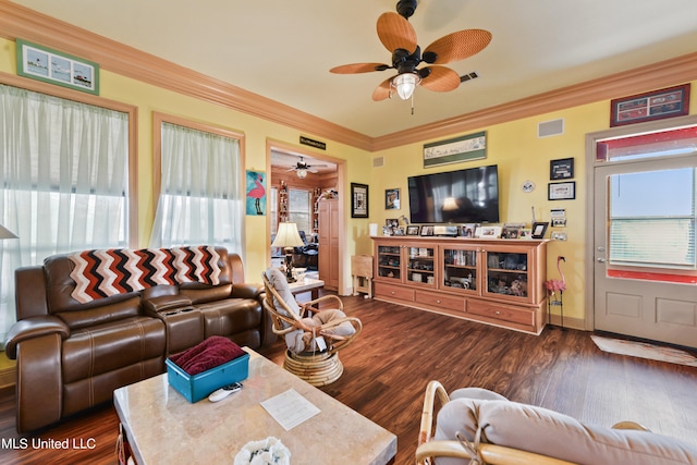 living room with ceiling fan, ornamental molding, plenty of natural light, and dark hardwood / wood-style floors