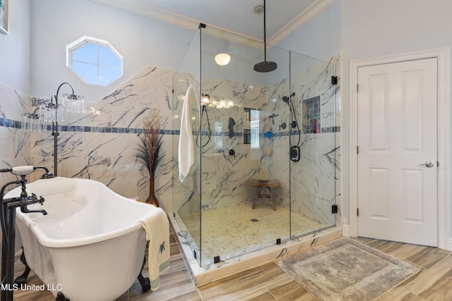 bathroom featuring crown molding, hardwood / wood-style floors, and plus walk in shower