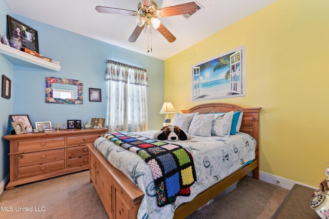 carpeted bedroom featuring ceiling fan