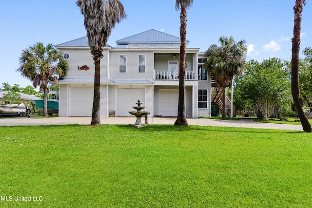 view of front of home with a front lawn, a garage, and a carport