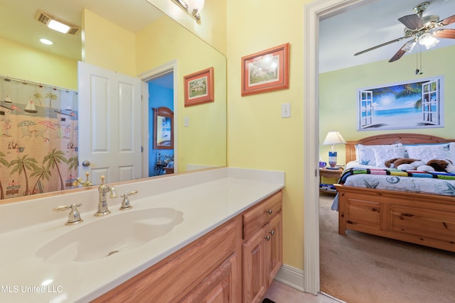 bathroom featuring vanity and ceiling fan