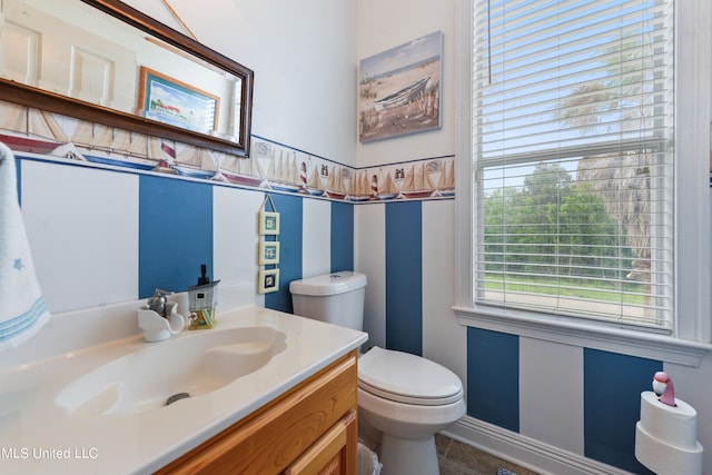 bathroom with toilet and vanity