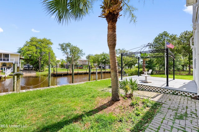 view of yard featuring a water view, a gazebo, and a patio area