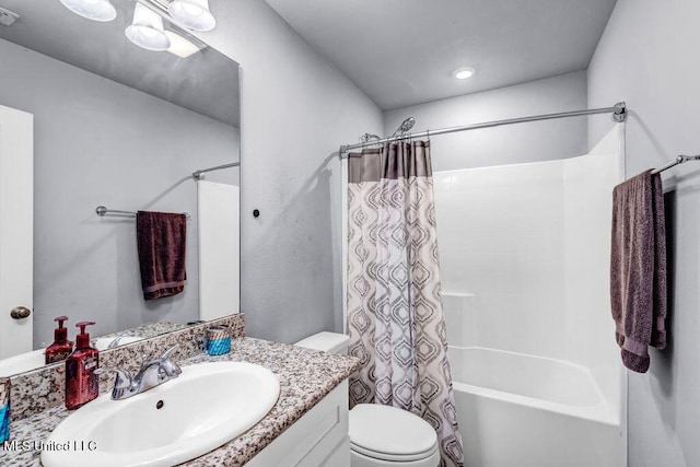 bathroom featuring visible vents, vanity, shower / bath combination with curtain, and toilet