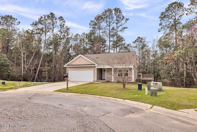 view of front of property with a garage, driveway, and a front lawn