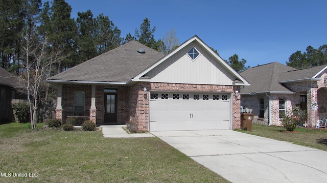 view of front of house with an attached garage, brick siding, driveway, and a front yard