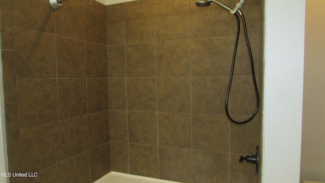 full bath featuring tiled shower