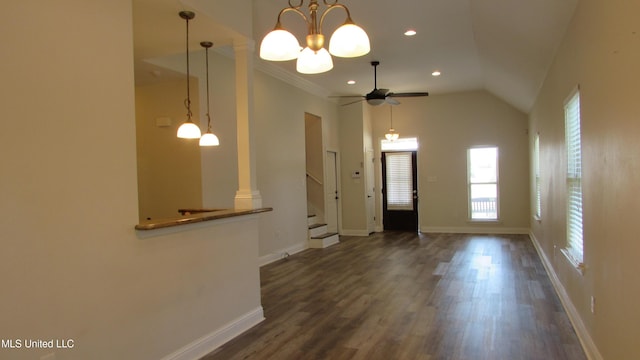 entryway with lofted ceiling, recessed lighting, dark wood-type flooring, baseboards, and stairway