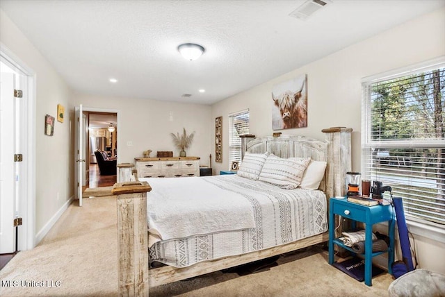 bedroom featuring light carpet