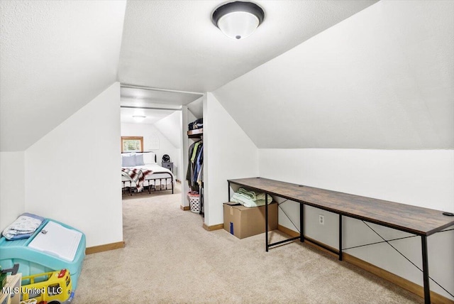 additional living space with lofted ceiling and light carpet