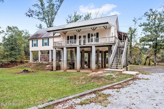 view of front of property featuring a front lawn and a patio area