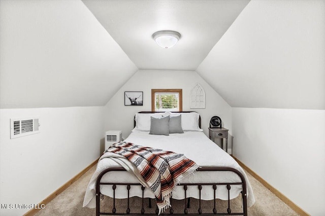 bedroom featuring carpet and lofted ceiling