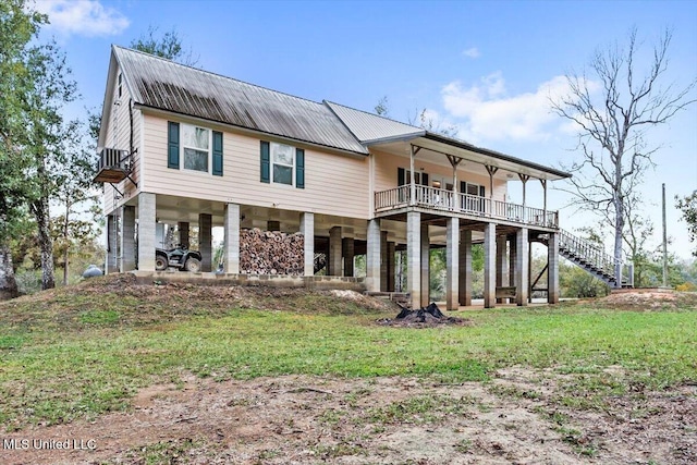 back of house featuring a yard