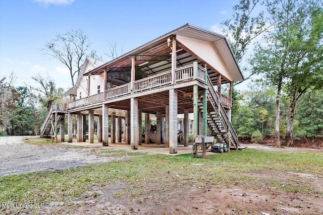 rear view of property featuring a deck