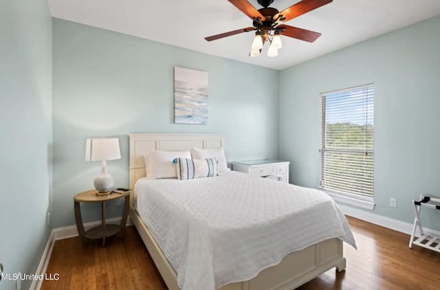 bedroom featuring hardwood / wood-style flooring and ceiling fan