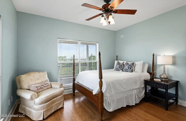 4011 S Nassau St, Bay Saint Louis, MS 39520 - bedroom featuring wood finished floors, baseboards, and a ceiling fan
