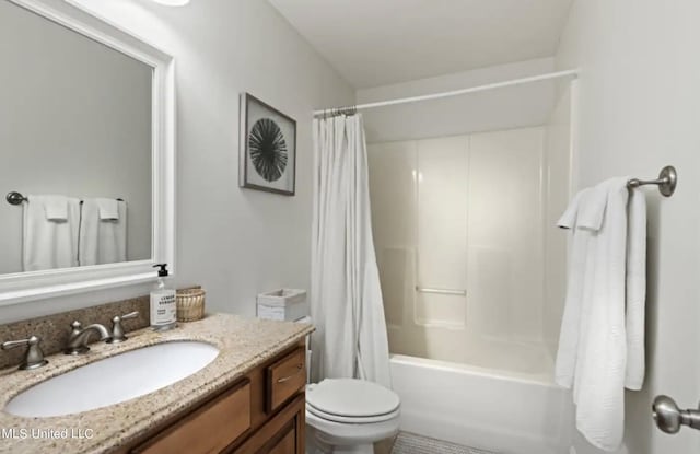 full bathroom featuring toilet, vanity, and shower / tub combo