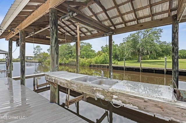 4011 S Nassau St, Bay Saint Louis, MS 39520 - dock featuring a water view, boat lift, a sink, and view of wooded area
