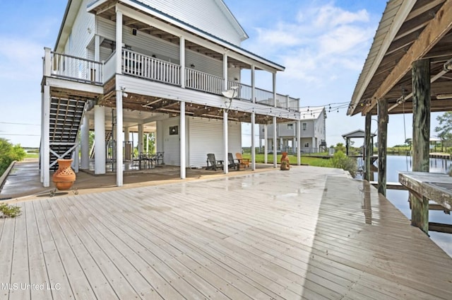 exterior space with a dock and a water view