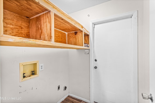 clothes washing area featuring hookup for an electric dryer, baseboards, laundry area, and washer hookup