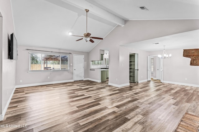 unfurnished living room featuring visible vents, baseboards, wood finished floors, ceiling fan with notable chandelier, and vaulted ceiling with beams