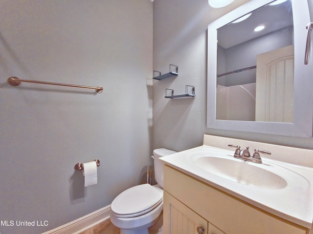 64 Oak Alley Ln, Long Beach, MS 39560 - bathroom featuring baseboards, toilet, and vanity