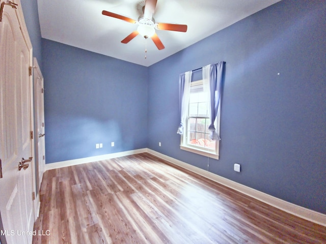 64 Oak Alley Ln, Long Beach, MS 39560 - empty room with ceiling fan, wood finished floors, and baseboards