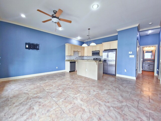 64 Oak Alley Ln, Long Beach, MS 39560 - kitchen featuring appliances with stainless steel finishes, light countertops, ceiling fan, a center island, and crown molding