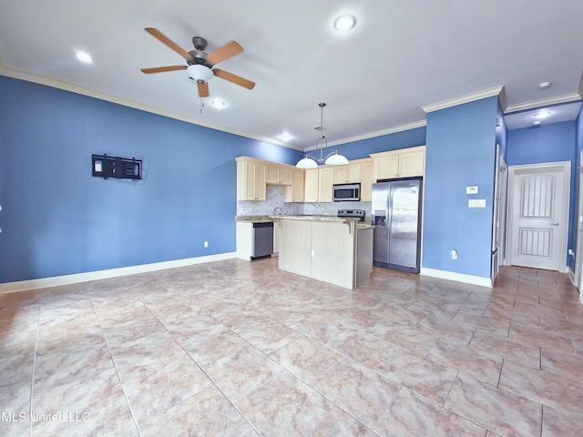 64 Oak Alley Ln, Long Beach, MS 39560 - kitchen featuring crown molding, appliances with stainless steel finishes, a kitchen island, light countertops, and a ceiling fan
