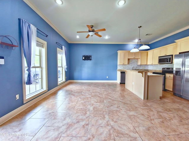 64 Oak Alley Ln, Long Beach, MS 39560 - kitchen featuring appliances with stainless steel finishes, ceiling fan, a kitchen island, and ornamental molding