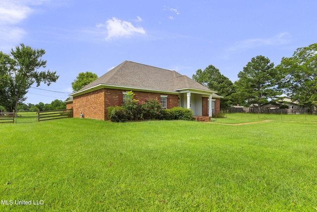 380 Green Acres Dr, Canton, MS 39046 - view of home's exterior featuring brick siding and roof with shingles